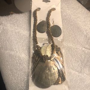 Buddha carved shell necklace, and matching earrings and bracelet.